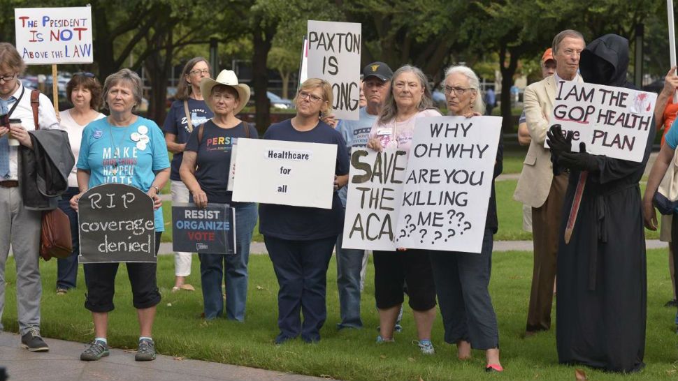 Supporters of the Affordable Care Act protest during a rally at Burnett Park in Fort Worth, Texas, Wednesday, Sept. 5, 2018. Democratic nominee for Texas Attorney General Justin Nelson hosted the Fort Worth Rally for Preexisting Coverage Protection. (Max Faulkner/Star-Telegram via AP)