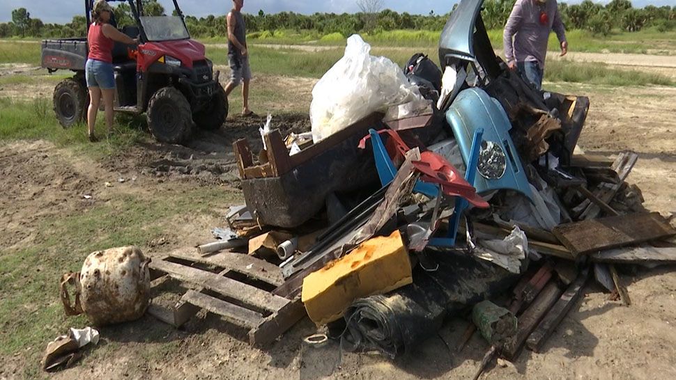 Volunteers gathered Sunday to help clean up "The Compound," a popular area in Palm Bay for extreme sports enthusiasts. (Krystel Knowles, staff)