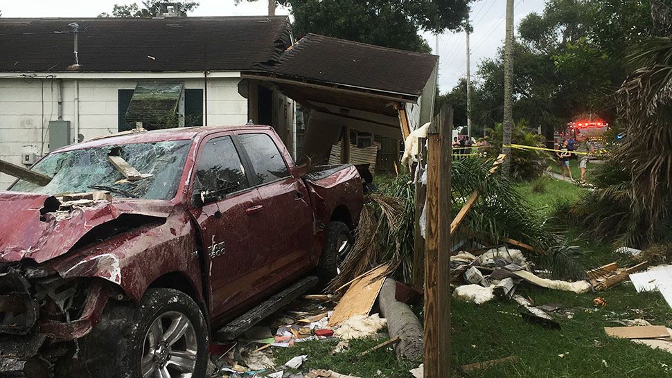 A pickup truck crashed through a St. Petersburg home Monday, injuring a woman who was inside. (St. Petersburg Fire and Rescue)