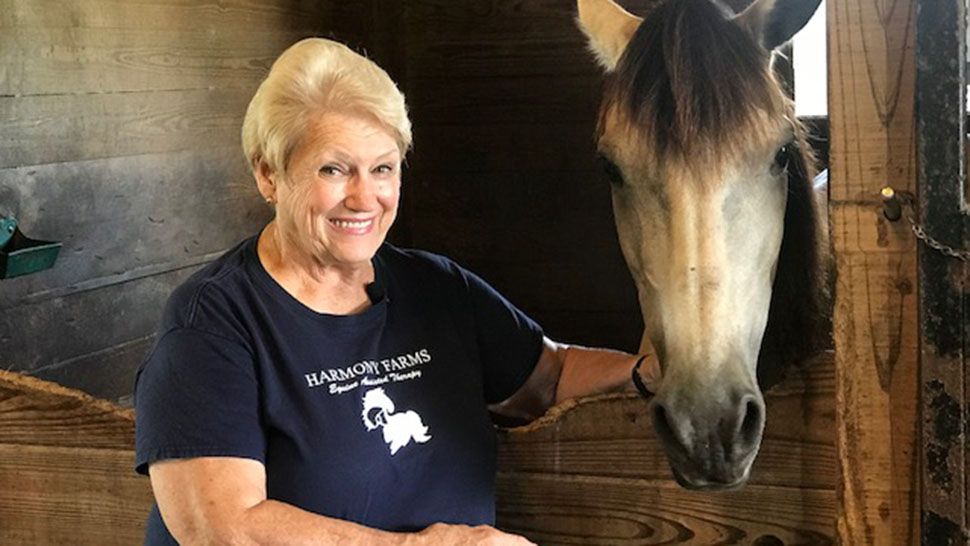 Pamela Rogan, of Harmony Farms, has used her love of horses to help children with disabilities. (Greg Pallone, staff)