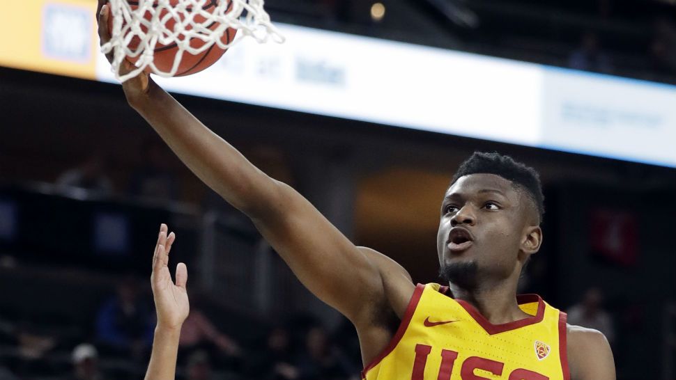 Southern California's Chimezie Metu (4) shoots during the first half of the team's NCAA college basketball game against Oregon State in the quarterfinals of the Pac-12 men's tournament Thursday, March 8, 2018, in Las Vegas. (AP Photo/Isaac Brekken)