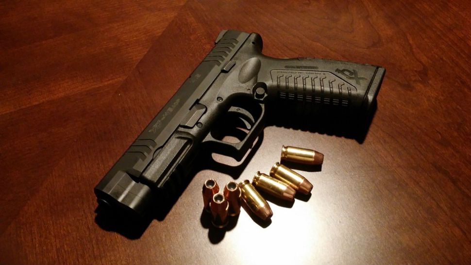 Image of handgun and ammunition. 