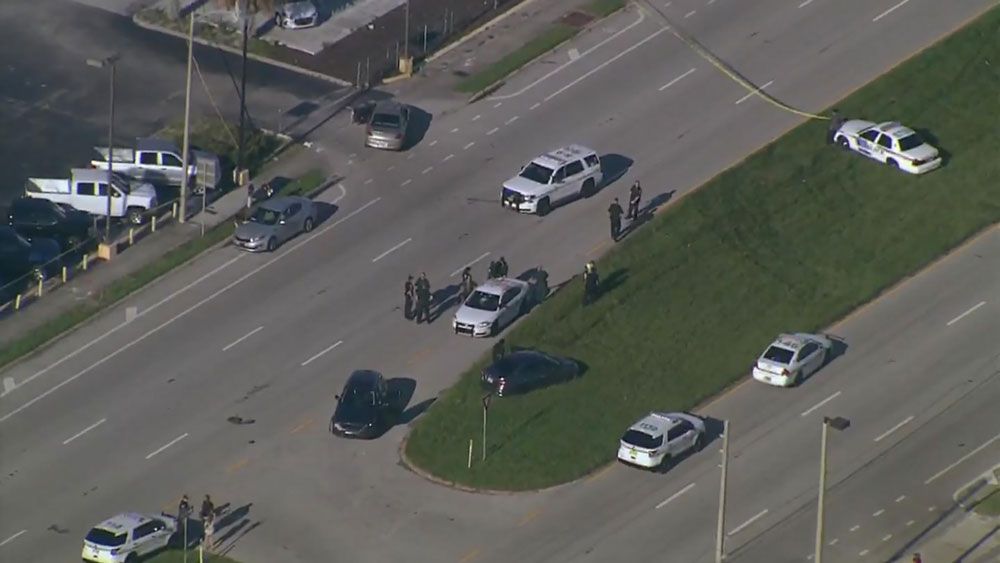 Law enforcement units block West Colonial Drive in both directions Thursday afternoon during a shooting investigation. (Sky 13)