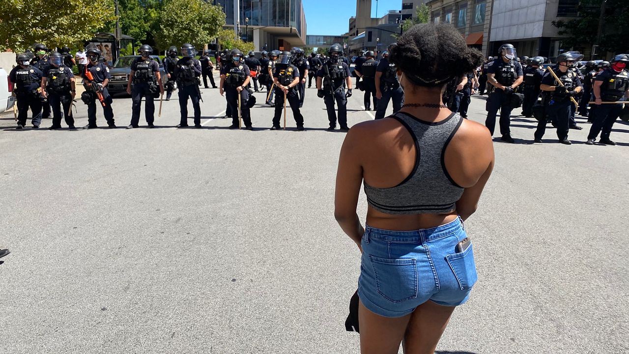 A protester refuses to move Saturday, Sept. 5, in downtown Louisville. (Brandon Roberts/Spectrum News 1 KY)