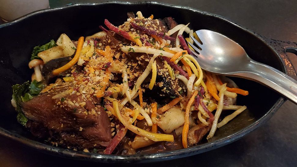 Sporks were distributed with dishes like the Braised Shaak Roast at Docking Bay 7 Food and Cargo at Star Wars: Galaxy's Edge. (Ashley Carter/Spectrum News)