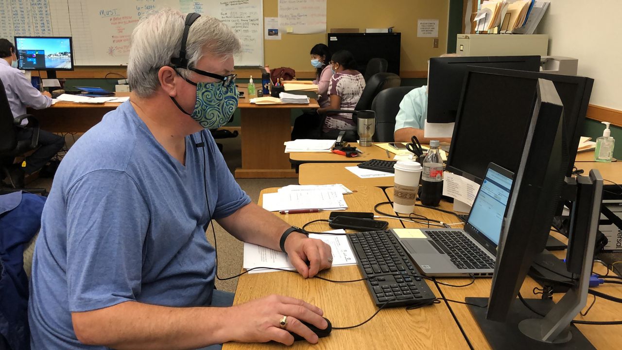 An employee works in the COVID-19 team at the Harrison County health department.