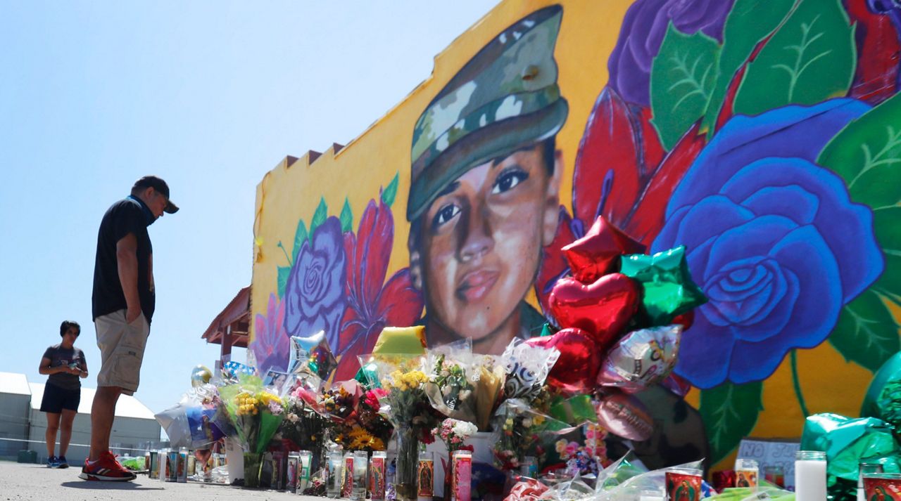 People look at a mural of slain Army Spc. Vanessa Guillen painted on a wall on the south side of Fort Worth, Texas, Saturday, July 11, 2020.  (AP Photo/LM Otero)