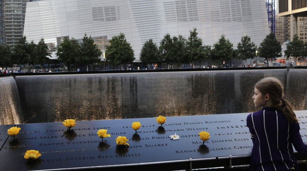 In this Sept. 8, 2013, file photo, Charlotte Newman, 8, visits the National September 11 Memorial and Museum in New York. on Sept. 11, 2020.  (AP Photo/Mark Lennihan, File)