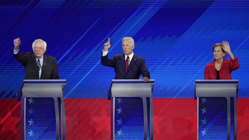 From left, Democratic presidential candidates Sen. Bernie Sanders, I-Vt., former Vice President Joe Biden and Sen. Elizabeth Warren, D-Mass. raise their hands to answer a question Thursday, Sept. 12, 2019, during a Democratic presidential primary debate hosted by ABC at Texas Southern University in Houston. (AP Photo/David J. Phillip)