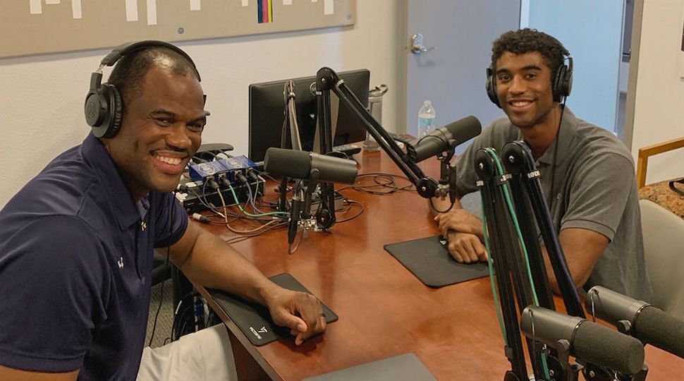 David Robinson and son David Robinson Jr. sitting at podcast table together (Courtesy: Geekdom Media)