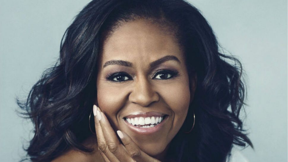 This cover image released by Crown shows "Becoming," by Michelle Obama, available on Nov. 13. Obama will visit 10 cities to promote her memoir “Becoming,” a tour featuring arenas and other performing centers to accommodate crowds likely far too big for any bookstore. The former first lady will begin at the United Center in her native Chicago on Nov. 13, the book’s release date. (Crown via AP)