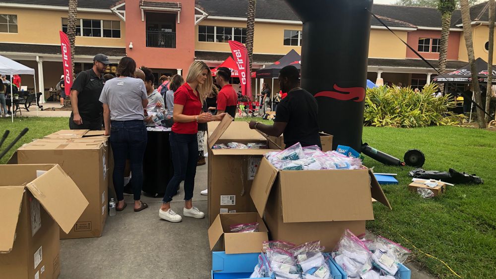 Students put together hygiene kits at Southeastern University Friday. The school is coordinating to send supplies to The Bahamas. (Stephanie Claytor, Spectrum News)