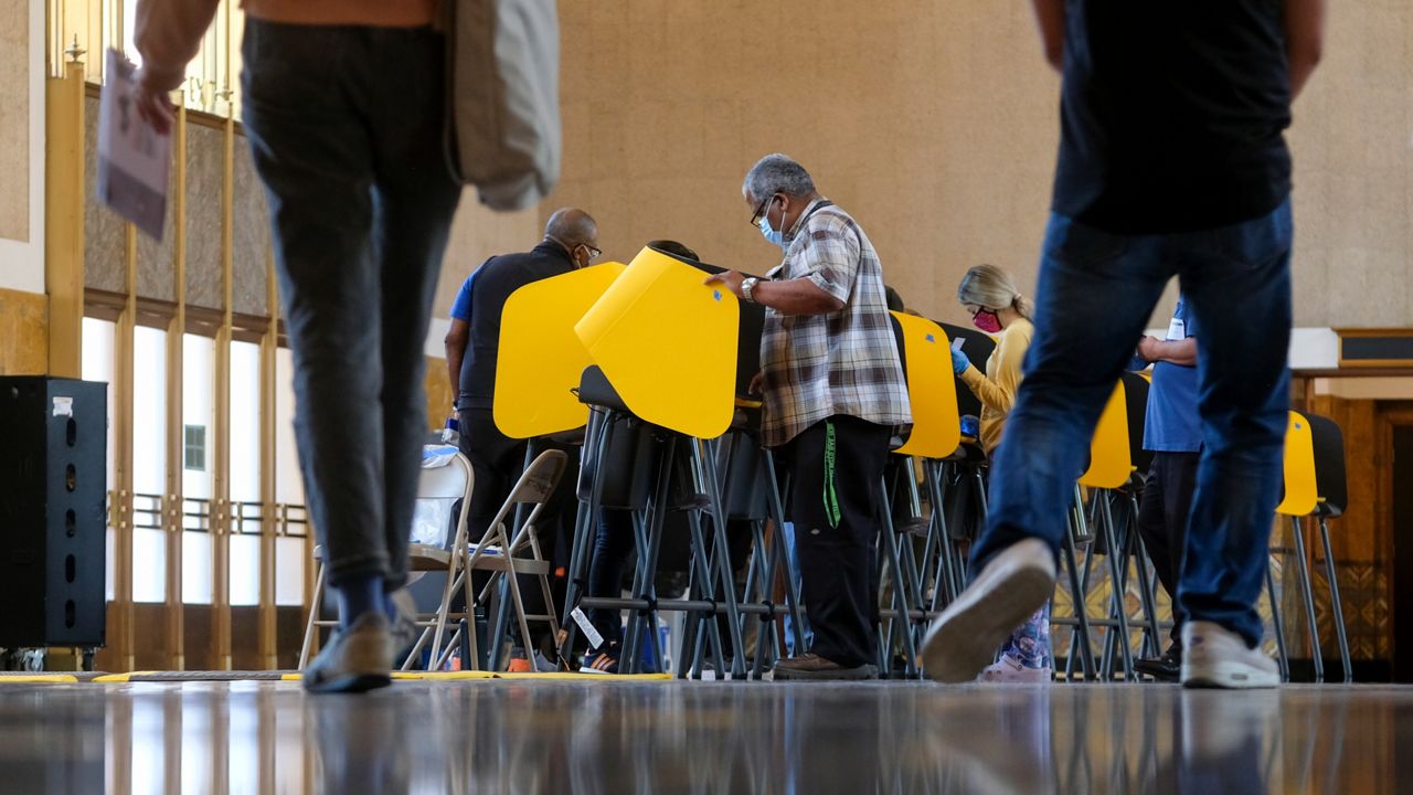 Voters cast their ballots for the California gubernatorial recall election at a vote center set up in Los Angeles Union Station, Tuesday, Sept. 14, 2021, in Los Angeles. (AP Photo/Ringo H.W. Chiu)