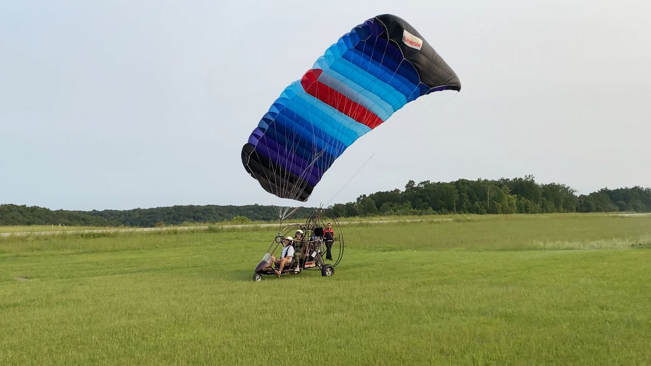 Tony and Julia Collier, of Grayson, Kentucky, prepare to take off in their powered parachute. 