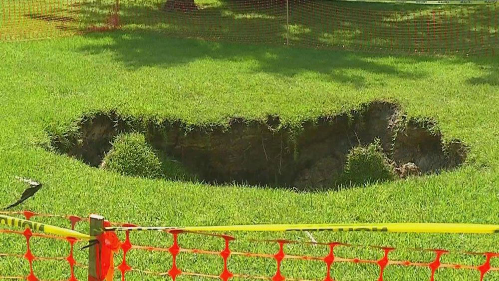 The sinkhole at Stetson University opened up Monday in a field with no other property nearby. (Spectrum News 13)