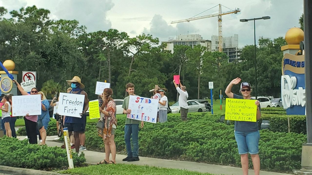 Disney World cast members marched Friday to protest Disney's COVID-19 vaccine mandate. (Spectrum News/Ashley Carter)
