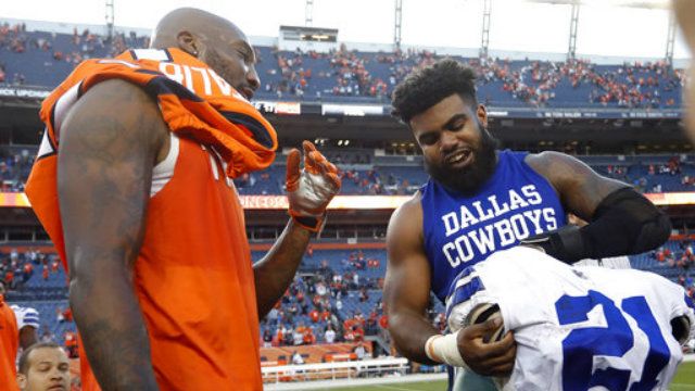 Dallas Cowboys running back Ezekiel Elliott, right, and Denver Broncos cornerback Aqib Talib exchange jerseys after an NFL football game, Sunday, Sept. 17, 2017, in Denver. The Broncos won 42-17. (AP Photo/Joe Mahoney)