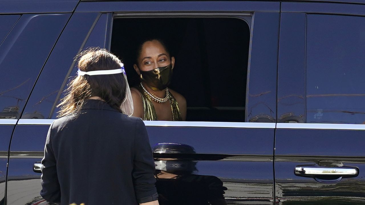 Actress Tracee Ellis Ross looks out from her limousine window after receiving a coronavirus test upon her arrival at the 72nd Primetime Emmy Awards at Staples Center, Sunday, Sept. 20, 2020, in Los Angeles. (AP Photo/Chris Pizzello)