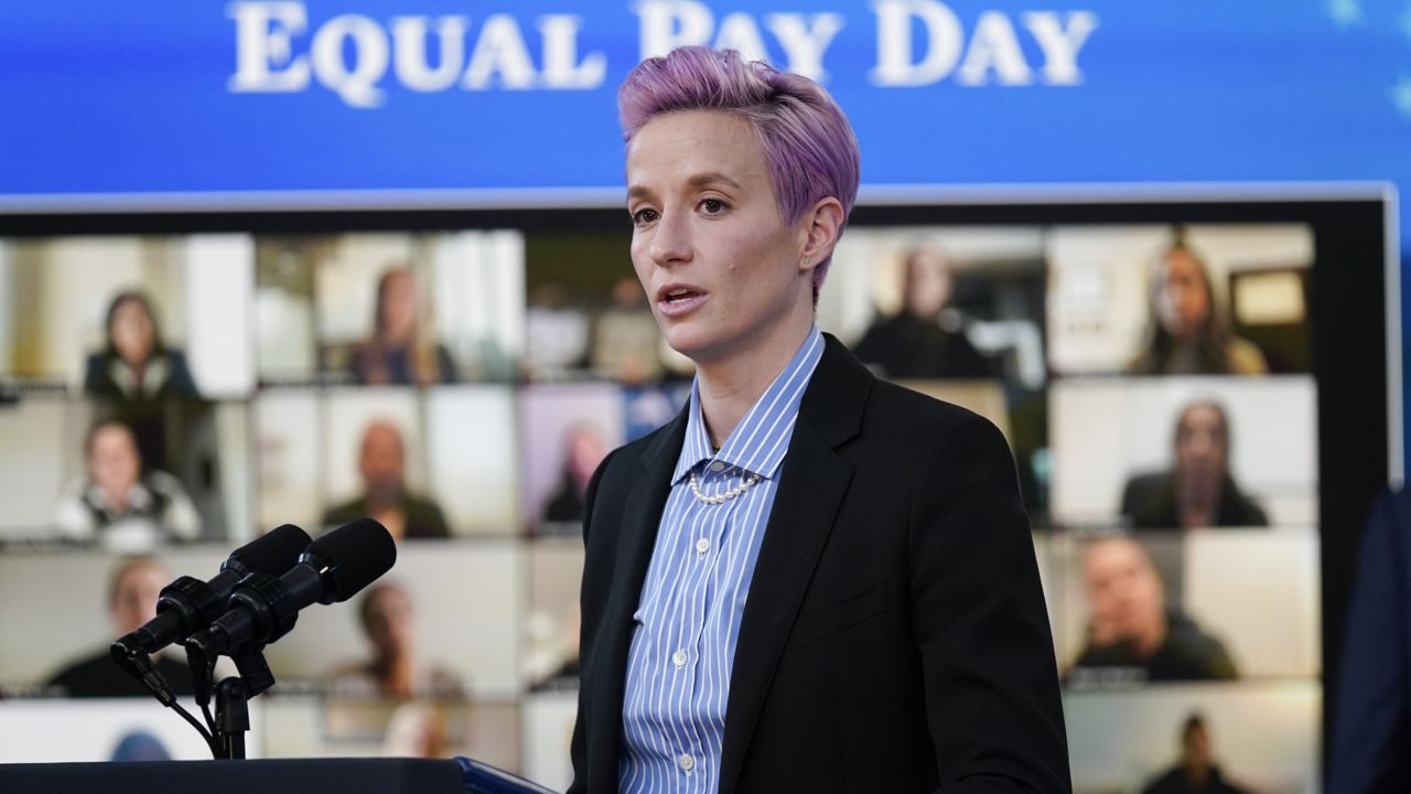 United States Soccer Women's National Team member Megan Rapinoe speaks during an event to mark Equal Pay Day in the South Court Auditorium in the Eisenhower Executive Office Building on the White House Campus Wednesday, March 24, 2021, in Washington. (AP Photo/Evan Vucci)