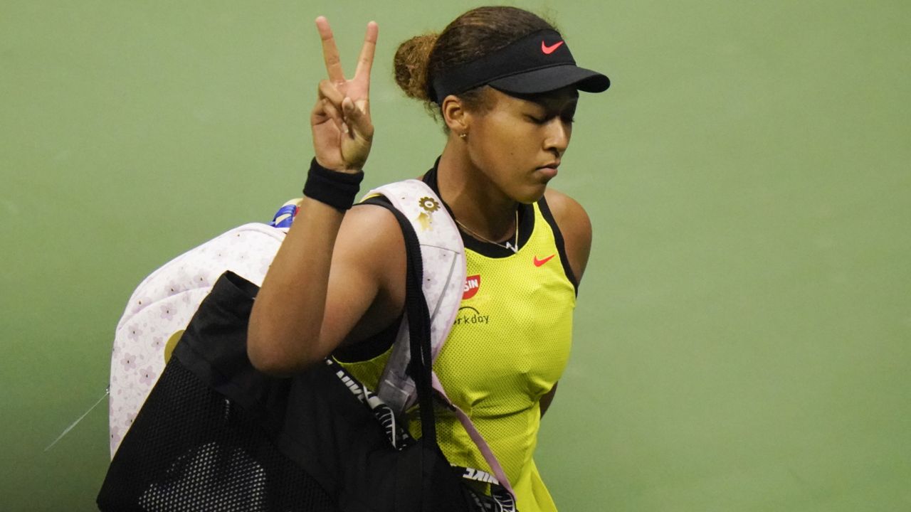 Naomi Osaka, of Japan, gestures to fans after losing to Leylah Fernandez, of Canada, during the third round of the US Open tennis championships, Friday, Sept. 3, 2021, in New York. (AP Photo/Frank Franklin II)