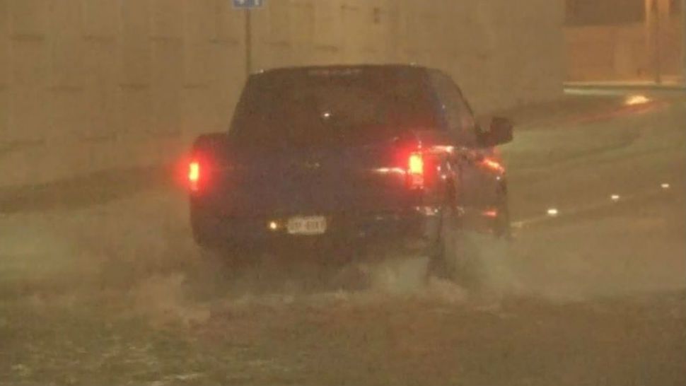 A truck drives through a flooded street in San Antonio. (Spectrum News/File)