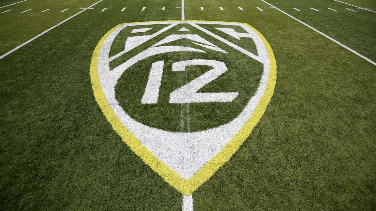 In this Oct. 10, 2015, file photo, a PAC-12 logo is displayed on the field before an NCAA college football game between Washington State and Oregon in Eugene, Ore. (AP Photo/Ryan Kang, File)