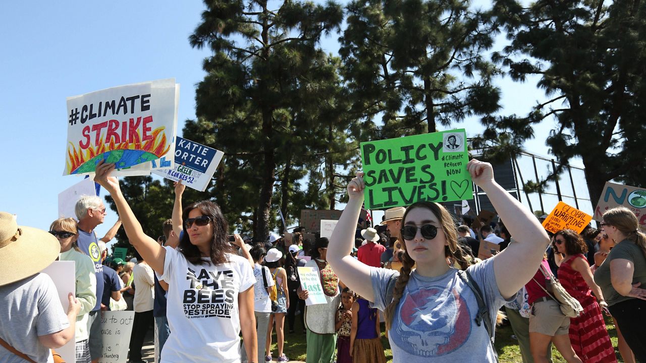 A large crowd gathered in Irvine for a climate change rally. (Raul Roa / Staff Photographer)