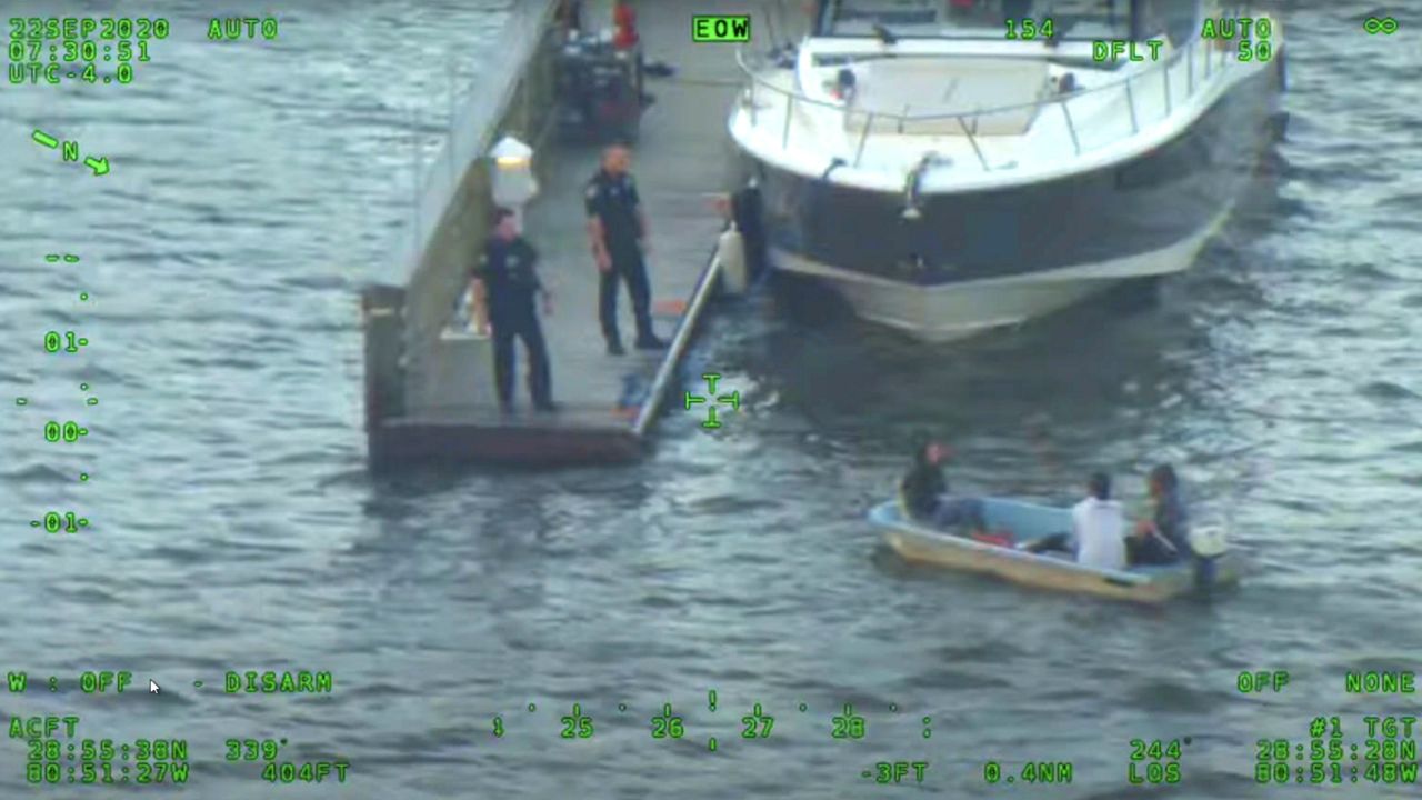 Deputies detain boaters on the Intracoastal Waterway earlier this week they said shined a laser at a Volusia County Sheriff's Office helicopter responding to a burglary call. One of the men said he mistook the helicopter for a drone. (Volusia County Sheriff's Office YouTube)