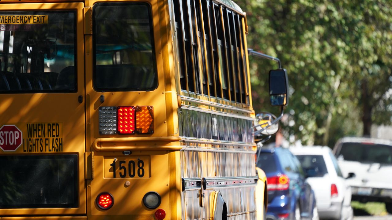 students exiting a bus in louisville