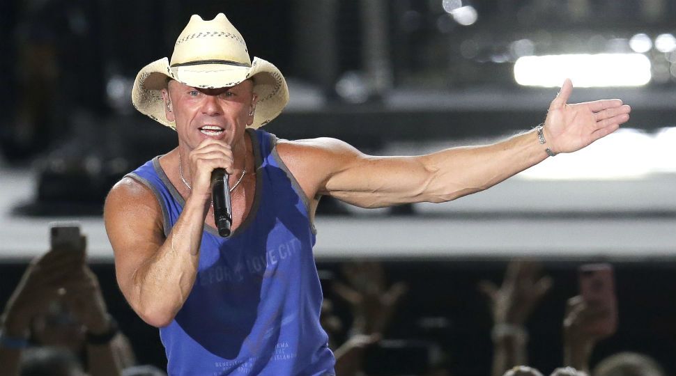 In this June 23, 2018 file photo, Kenny Chesney performs during the Trip Around the Sun Tour in Phoenix. (Photo by Rick Scuteri/Invision/AP, File)