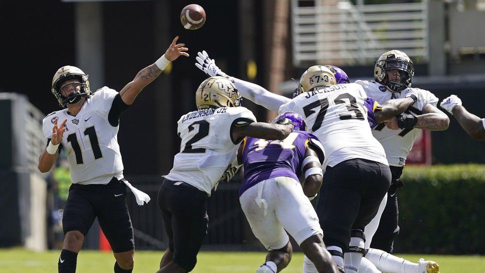 UCF quarterback Dillon Gabriel (11) passes against East Carolina during the first half of an NCAA college football game in Greenville, N.C., Saturday, Sept. 26, 2020. (AP Photo/Gerry Broome)