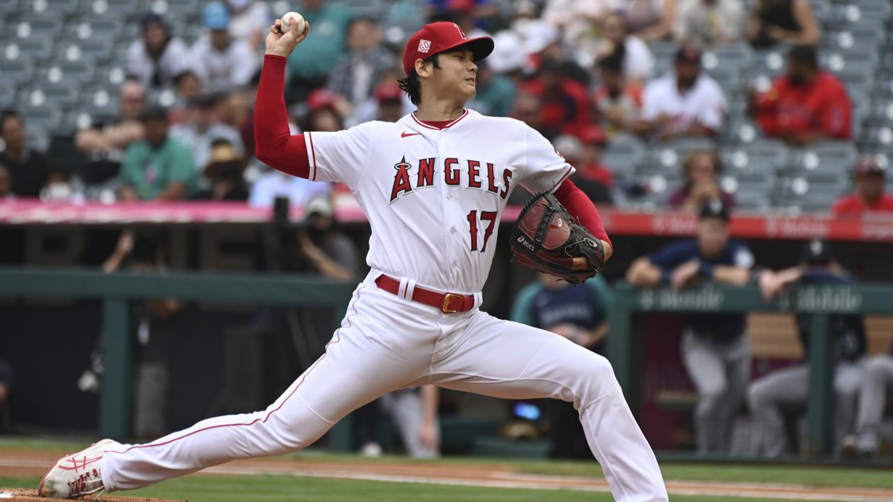 Los Angeles Angels pitcher Shohei Ohtani throws to home plate during the first inning of a baseball game against the Seattle Mariners, Sunday, Sept. 26, 2021, in Anaheim, Calif. (AP Photo/Michael Owen Baker)