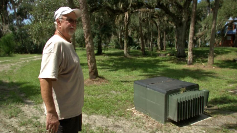 Dave Day says Florida Power and Light wants him and his neighbor to pay to fix a transformer box that floods after big storms, knocking out his power. (Jeff Allen/Spectrum News 13)
