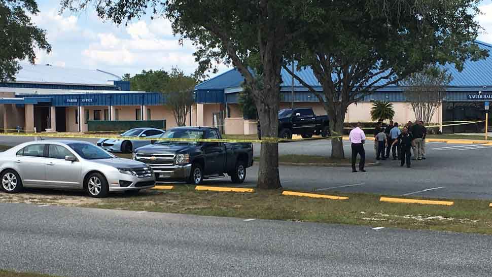 Police tape around the scene of a reported shooting in the parking lot of St. Francis Cabrini Catholic Church in Spring Hill, Friday, Sept. 27, 2019. (Sarah Blazonis/Spectrum Bay News 9)