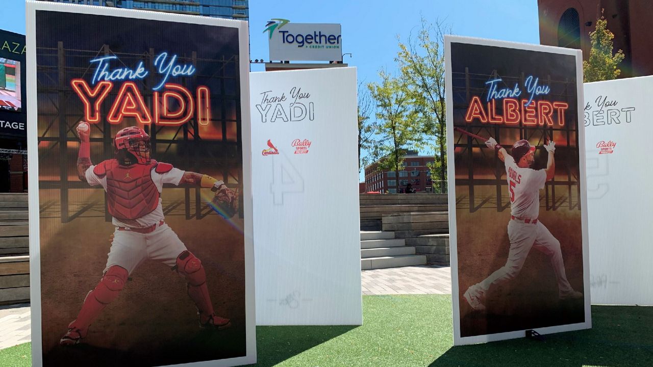 Sign a giant thank you card for Molina, Pujols