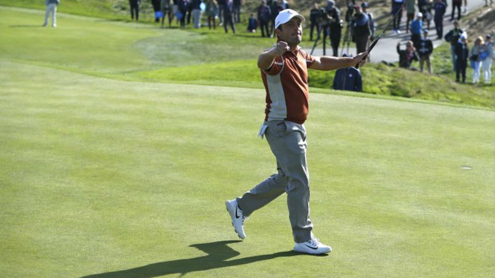 Europe’s Francesco Molinari celebrates after winning the 12th hole during a fourball match on the second day of the 42nd Ryder Cup at Le Golf National in Saint-Quentin-en-Yvelines, outside Paris, France, Saturday, Sept. 29, 2018. (AP Photo/Alastair Grant)