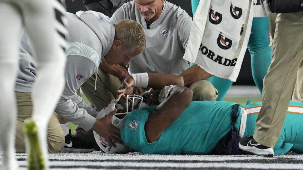 Miami Dolphins quarterback Tua Tagovailoa is examined during the first half of the team's NFL football game against the Cincinnati Bengals, Thursday, Sept. 29, 2022, in Cincinnati. (AP Photo/Jeff Dean)