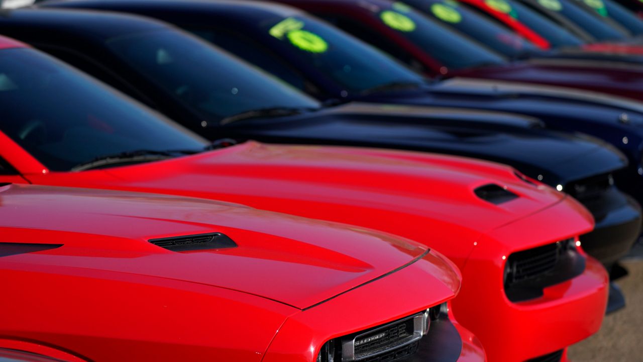 A line of used cars (AP Photo/David Zalubowski)