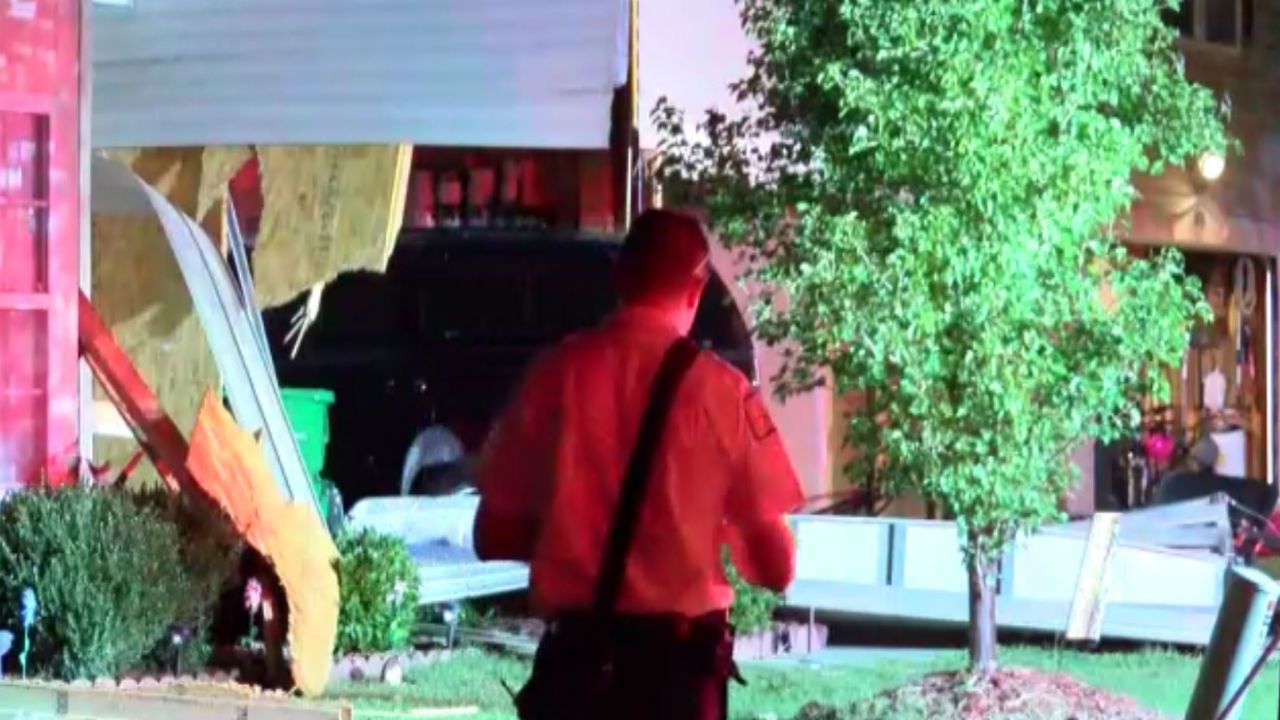 One person injured after vehicle crashes into two houses