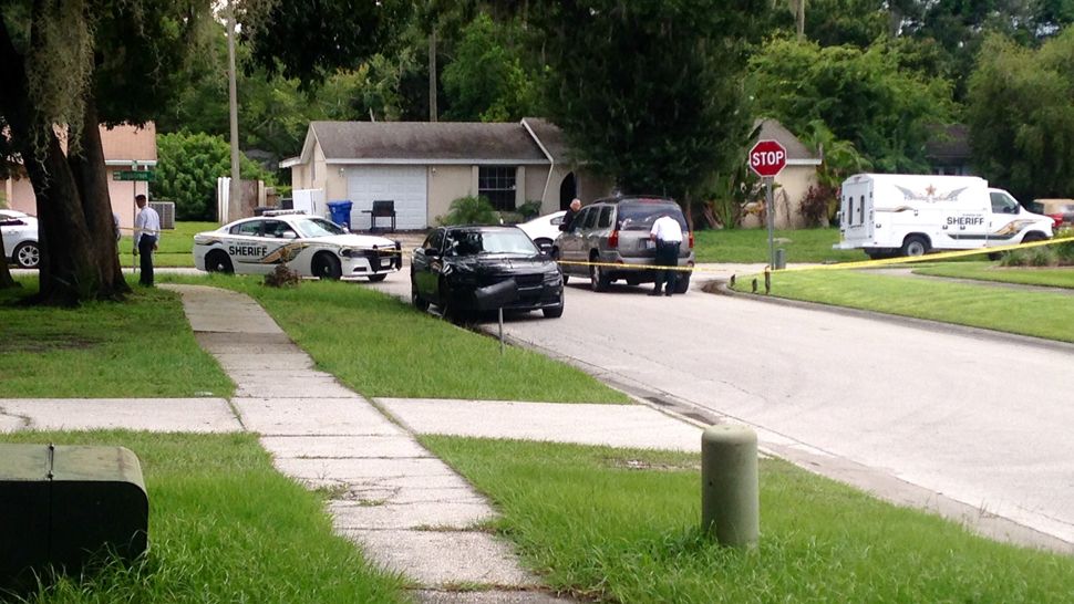 Hillsborough County deputies outside a home on the corner of Wisperbreath Lane and Tamarix Drive in Tampa. 