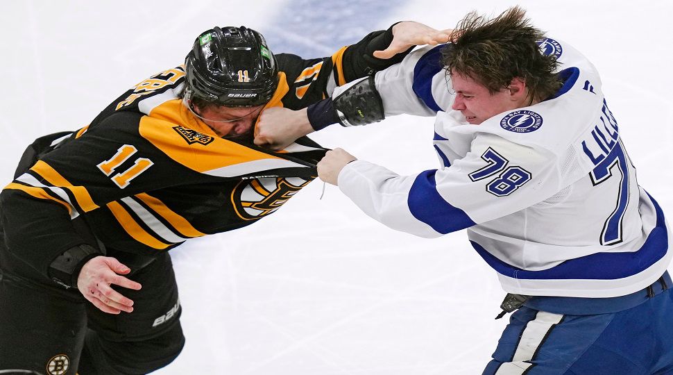 Tampa Bay Lightning defenseman Emil Lilleberg (78) lands a punch during his fight with Boston Bruins center Trent Frederic (11) during the second period of an NHL hockey game, Tuesday, Jan. 14, 2025, in Boston. (AP Photo/Charles Krupa)