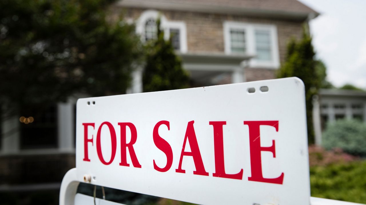 House with "for sale" sign