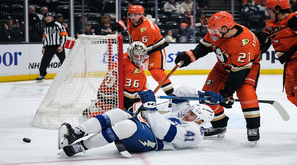 Tampa Bay Lightning right wing Mitchell Chaffee (41) and Anaheim Ducks center Isac Lundestrom (21) vie for the puck during the second period of an NHL hockey game Sunday, Jan. 5, 2025, in Anaheim, Calif. (AP Photo/William Liang)