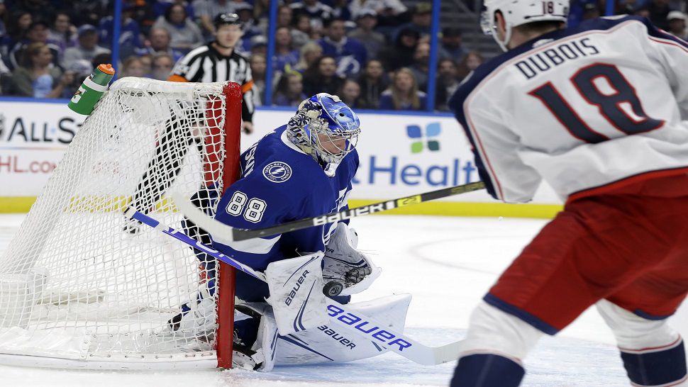 Tampa Bay goalie Andrei Vasilevskiy records one of his 17 saves, as the recently-named All-Star notched his second shutout of the season in the 4-0 win over Columbus.  (AP Photo/Chris O'Meara)