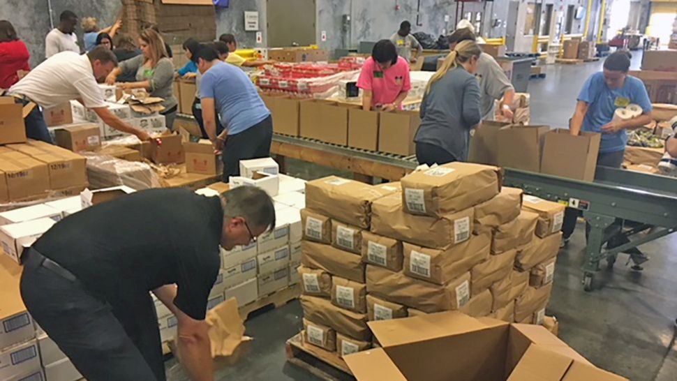 Volunteers are pitching in by preparing 2,000 disaster relief boxes to be sent to areas impacted by Hurricane Michael. (Julie Gargotta/Spectrum News)