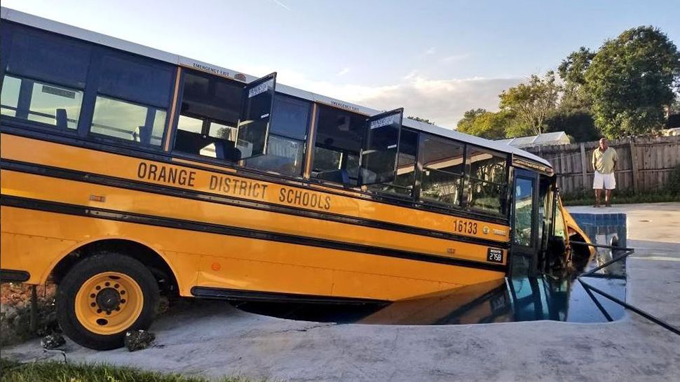 The students and driver on the school bus that was heading to the Magnolia School were not injured in the crash. (Orange County Fire Rescue)