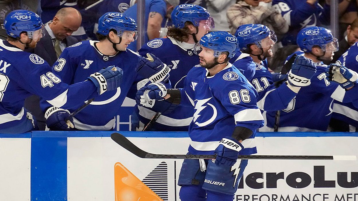 Tampa Bay Lightning right wing Nikita Kucherov (86) celebrates with the bench after his goal against the Vancouver Canucks during the first period of an NHL hockey game Tuesday, Oct. 15, 2024, in Tampa, Fla. (AP Photo/Chris O'Meara)