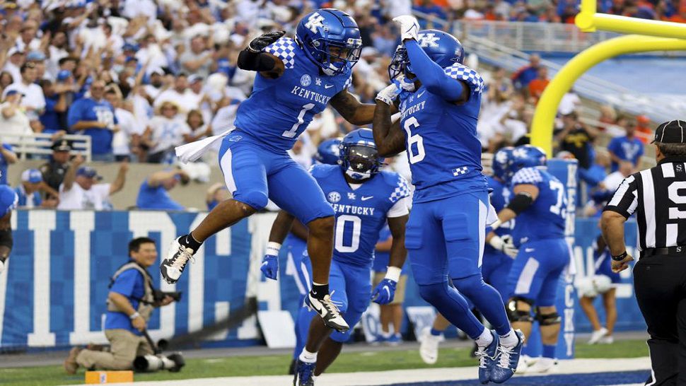 Kentucky wide receiver Wan'Dale Robinson (1) celebrates with wide receiver Josh Ali (6) after scoring a touchdown during the first half of Kentucky's 20-13 upset win over the #10 Gators. (AP Photo/Michael Clubb)