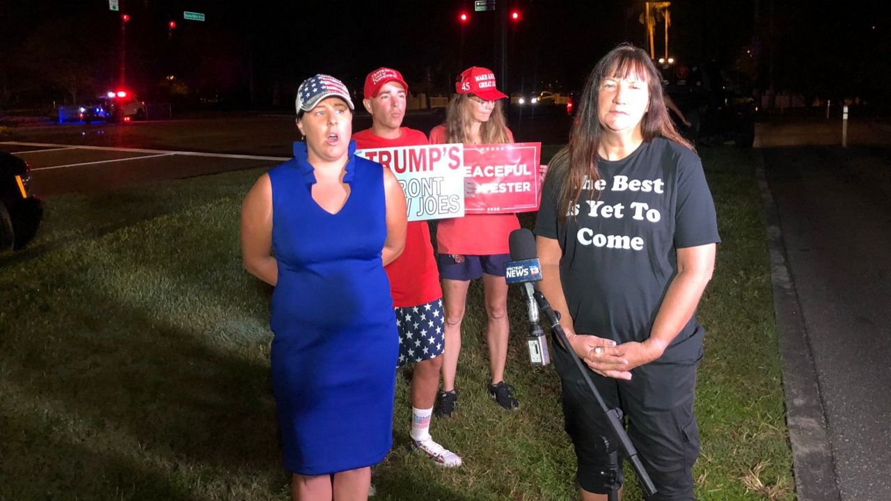 Saundra Kiczenski and Regina are friends from the Midwest and met going to Trump rallies. They have traveled across different states to be at the Villages on Friday, October 23, 2020. (Justin Soto/Spectrum News)
