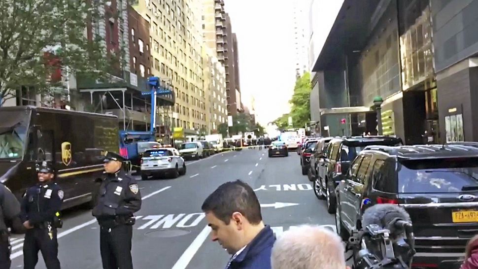 Police work near CNN's offices after they were evacuated because of a suspicious package on Wednesday, Oct. 24, 2018, in New York. (AP Photo)